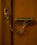 3459057-chain-lock-on-a-cherry-door.jpg