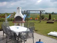 Terrasse mit Kamin.webp