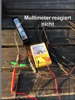 G_Mähroboter_Problem__Multimeter_Trafo_Kabel_Messung_Pfeil__03.2014_mr.ditschy.webp