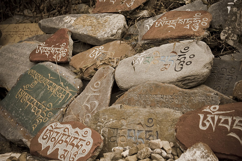 800px-Stone_tablets_with_prayers_in_Tibetan_language_at_a_Temple_in_McLeod_Ganj.jpg